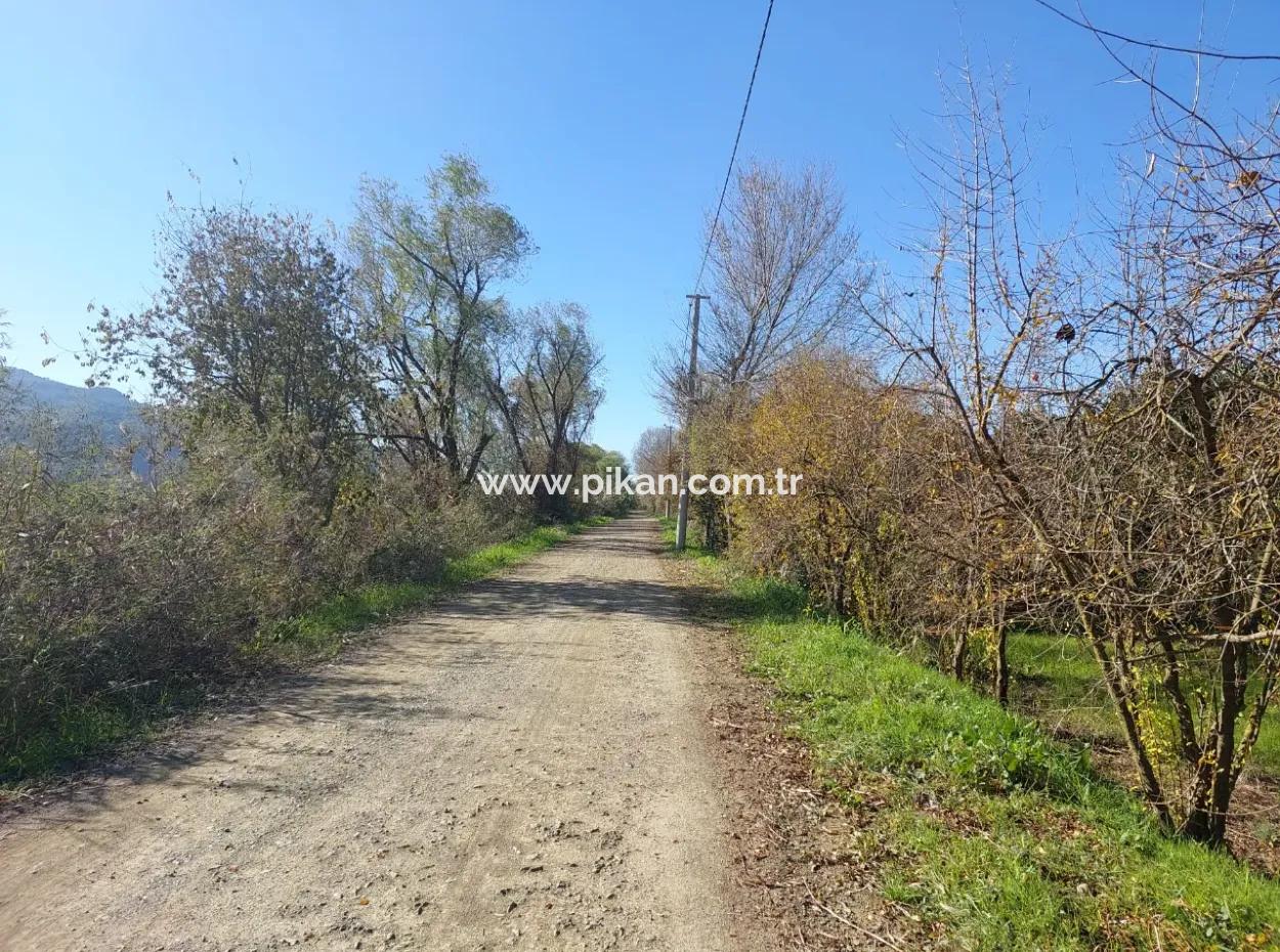 In Ortaca Okçular, A 1000 M2 Detached Land Is For Sale With 250 M2 Construction Rights Or Exchanged For 2-3 Flats From Ortaca