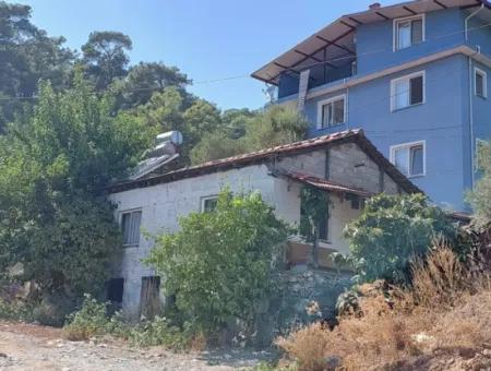 Muğla Ortaca Sarıgerme Merkezde  485 M² İmarlı Satılık Arsa – Köy Evi + Depolu